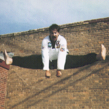 School instructor doing a flying split kick